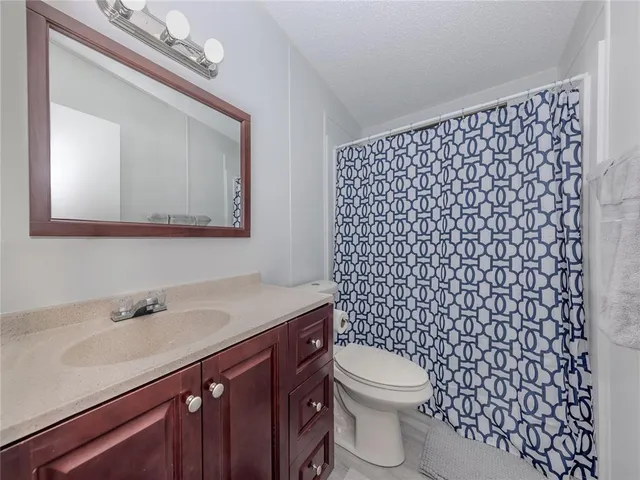 a view of a house with pool and a yard