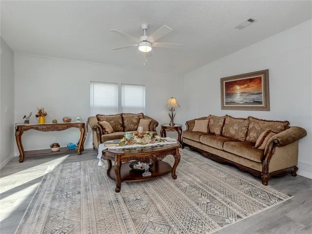a living room with furniture and a rug