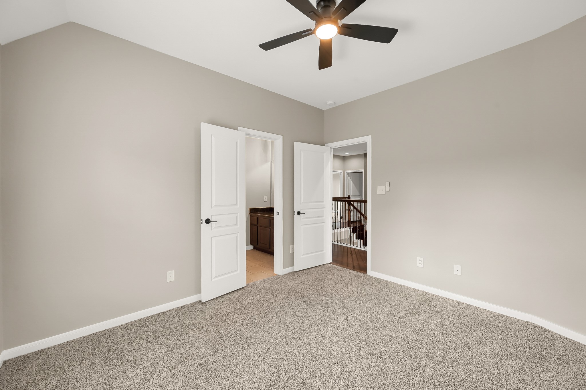 2425 West Bramlet Drive Conroe, TX 77304 - Photo 17 of 31 an empty room with a empty space and a ceiling fan