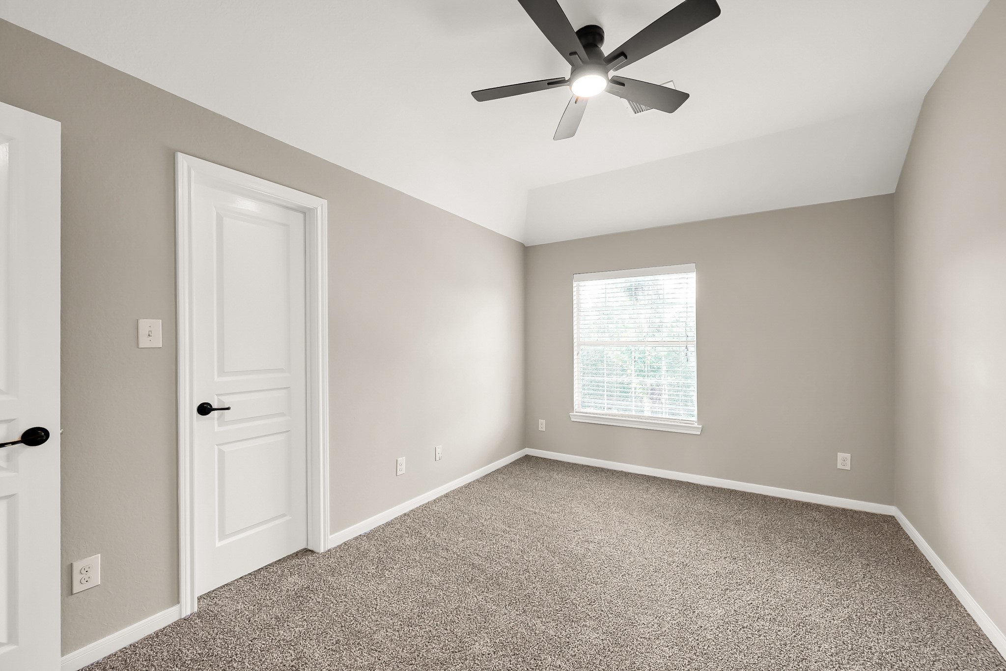 2425 West Bramlet Drive Conroe, TX 77304 - Photo 19 of 31 a view of empty room with ceiling fan