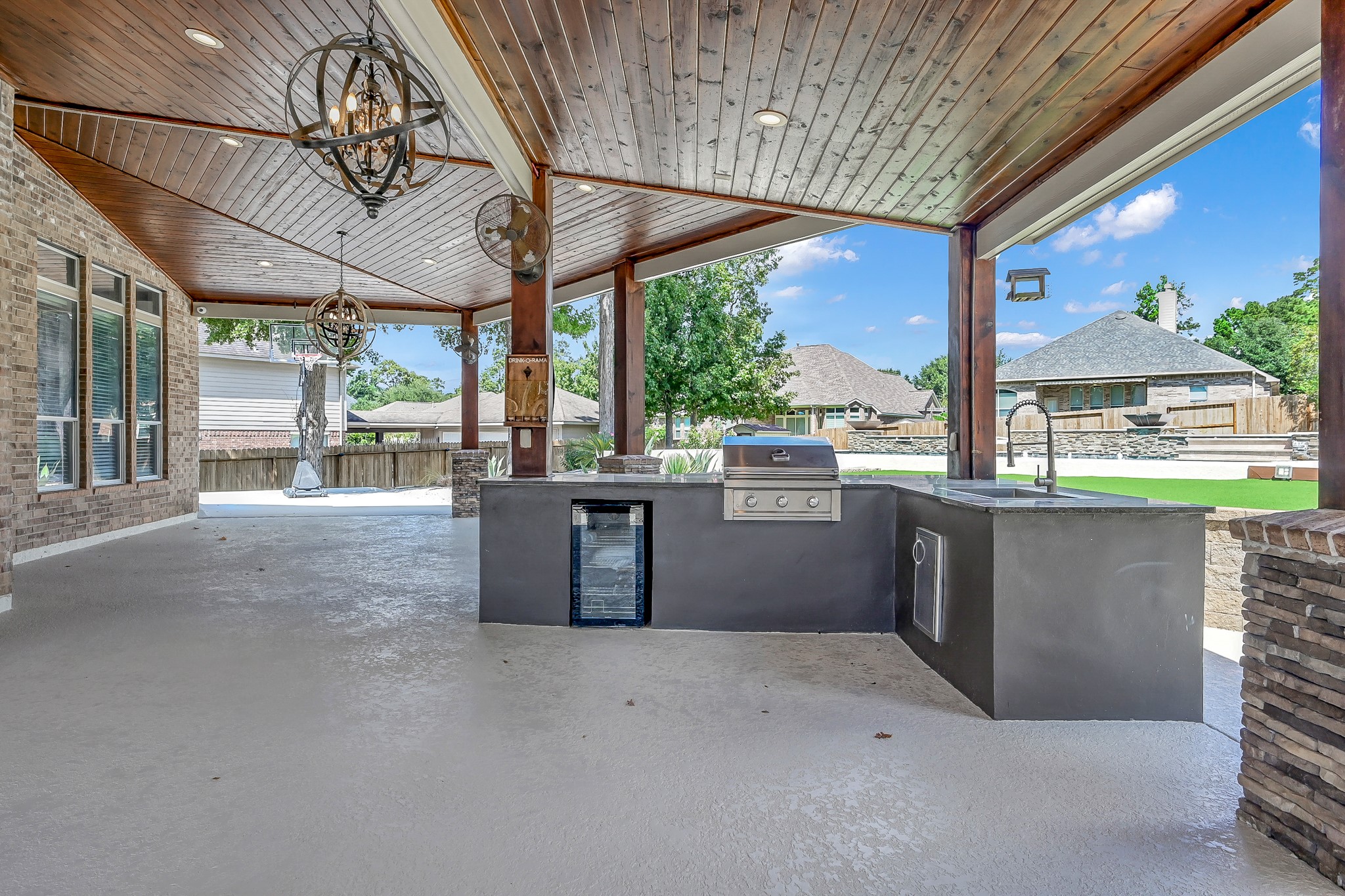 2425 West Bramlet Drive Conroe, TX 77304 - Photo 25 of 31 a view of a room with a large window and chandelier