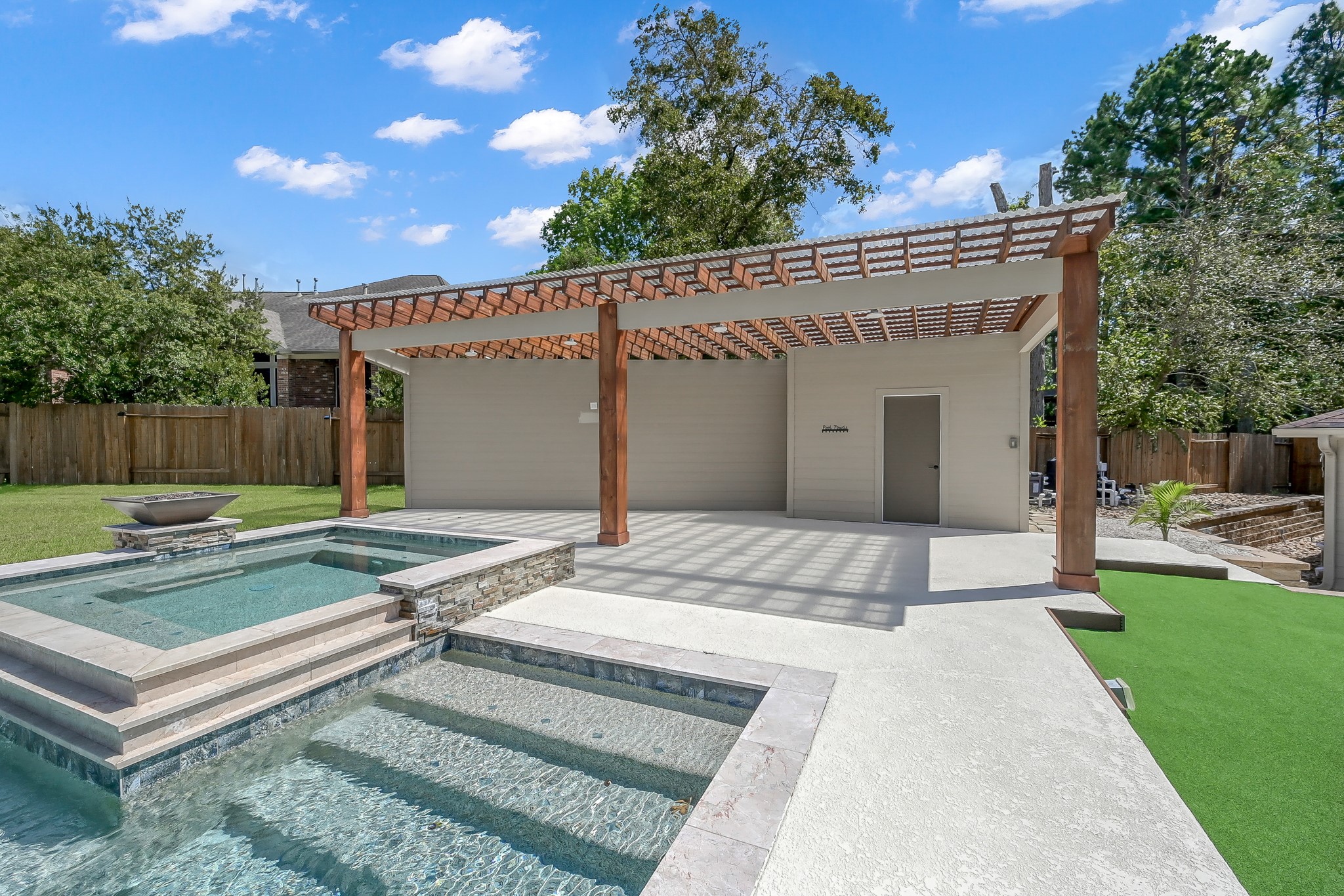 2425 West Bramlet Drive Conroe, TX 77304 - Photo 29 of 31 a view of a house with backyard and sitting area