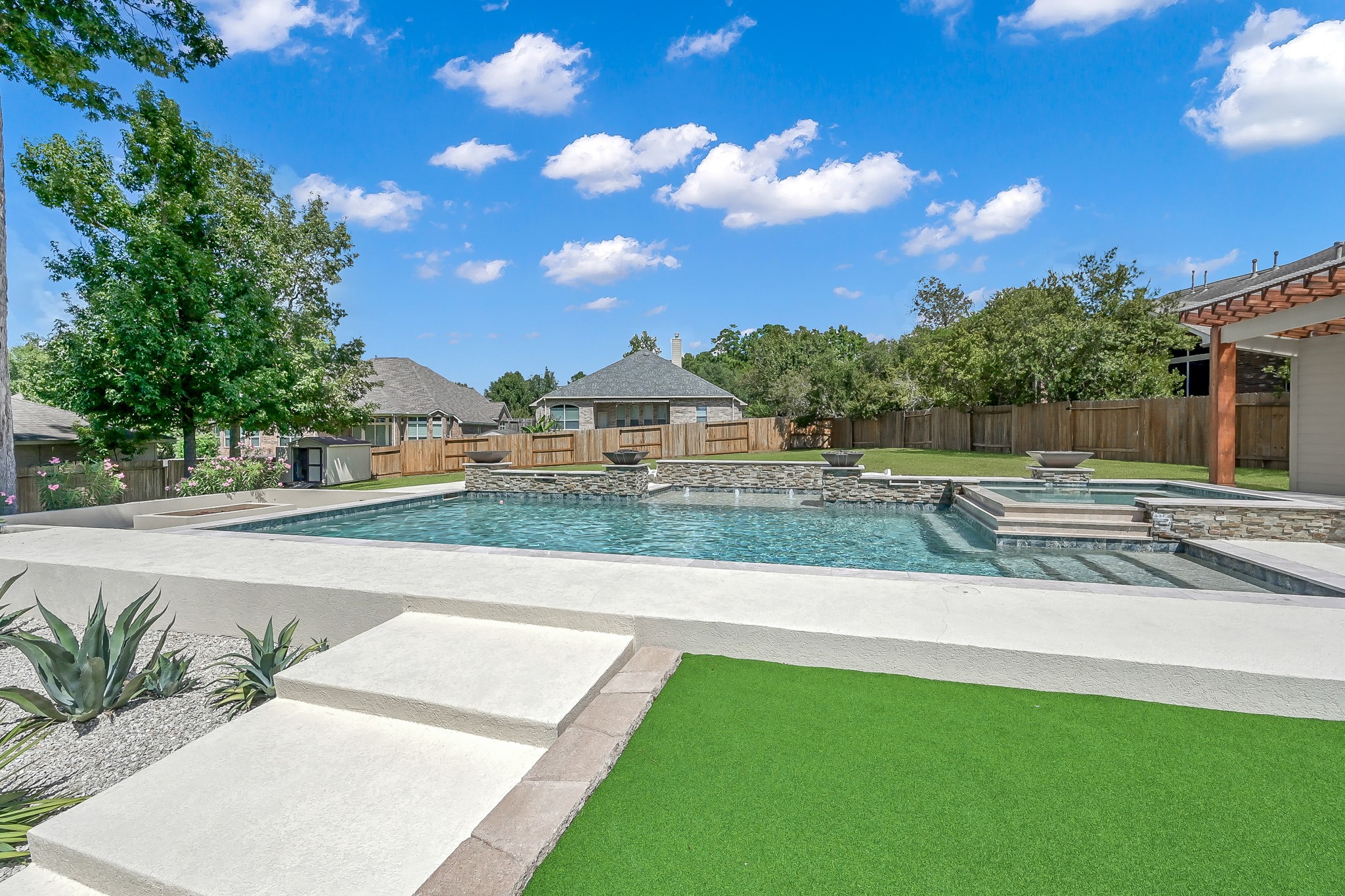 2425 West Bramlet Drive Conroe, TX 77304 - Photo 30 of 31 a view of a swimming pool and a yard