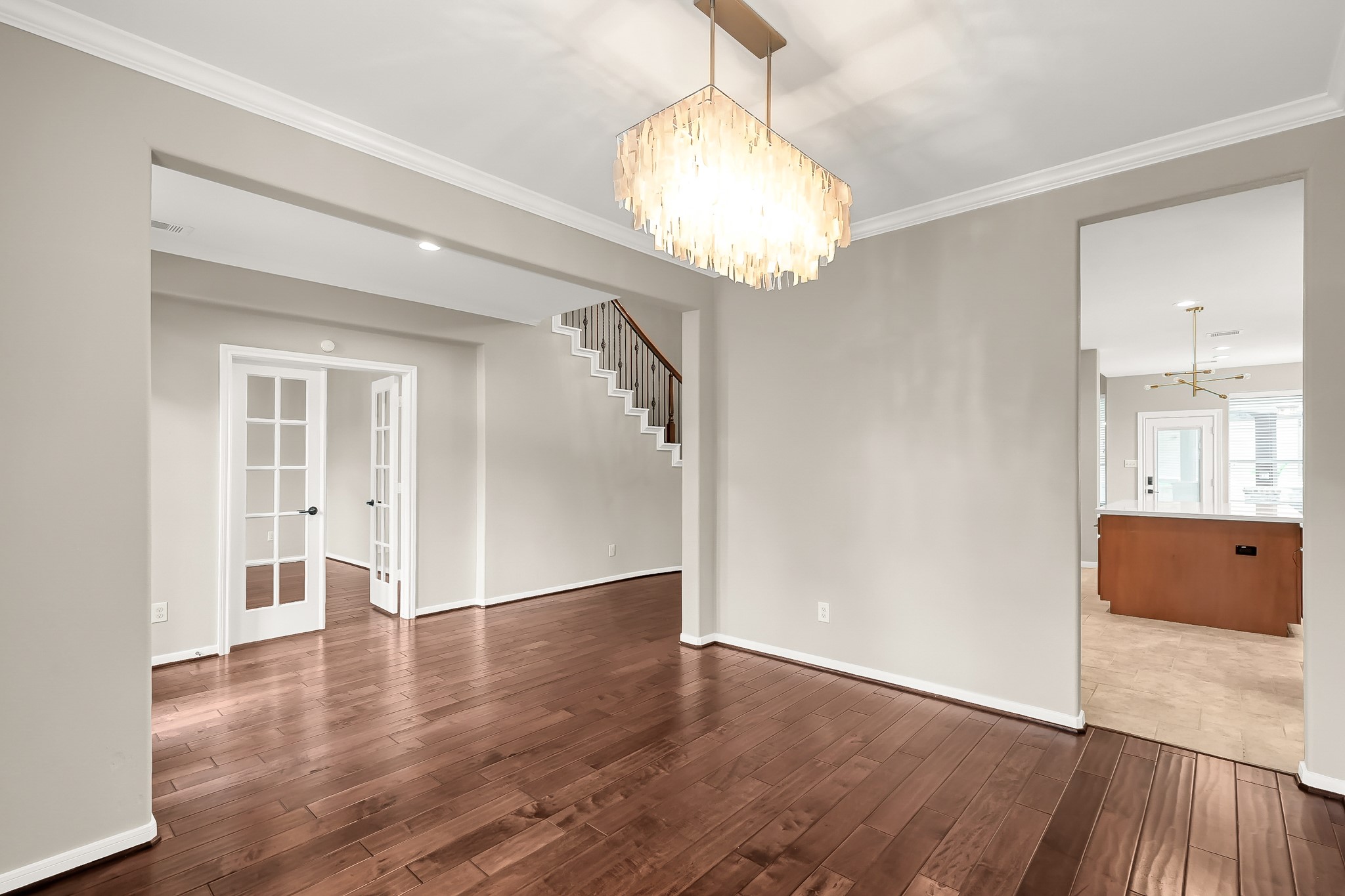 2425 West Bramlet Drive Conroe, TX 77304 - Photo 5 of 31 a view of an empty room with wooden floor and a window