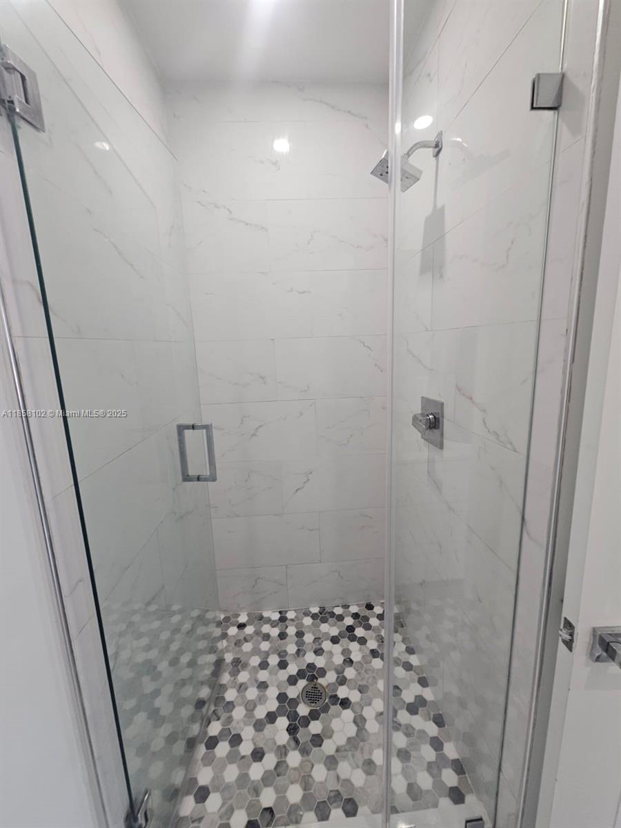 1610 Euclid Avenue, Unit A107 Miami Beach, FL 33139 - Photo 12 of 14 a bathroom with a shower