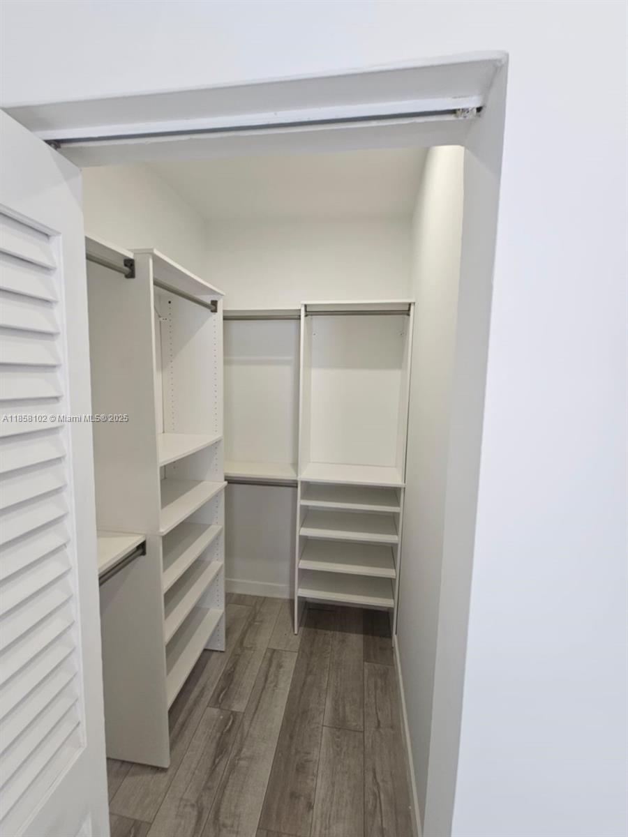 1610 Euclid Avenue, Unit A107 Miami Beach, FL 33139 - Photo 10 of 14 a view of walk in closet with empty racks