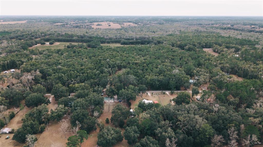 6016 Southwest 52nd Terrace Lake Butler, FL 32054 - Photo 1 of 10 an aerial view of house with yard and mountain view
