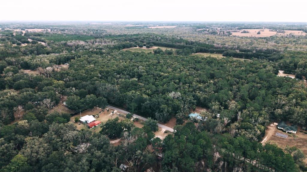 6016 Southwest 52nd Terrace Lake Butler, FL 32054 - Photo 3 of 10 an aerial view of residential house with outdoor space and trees