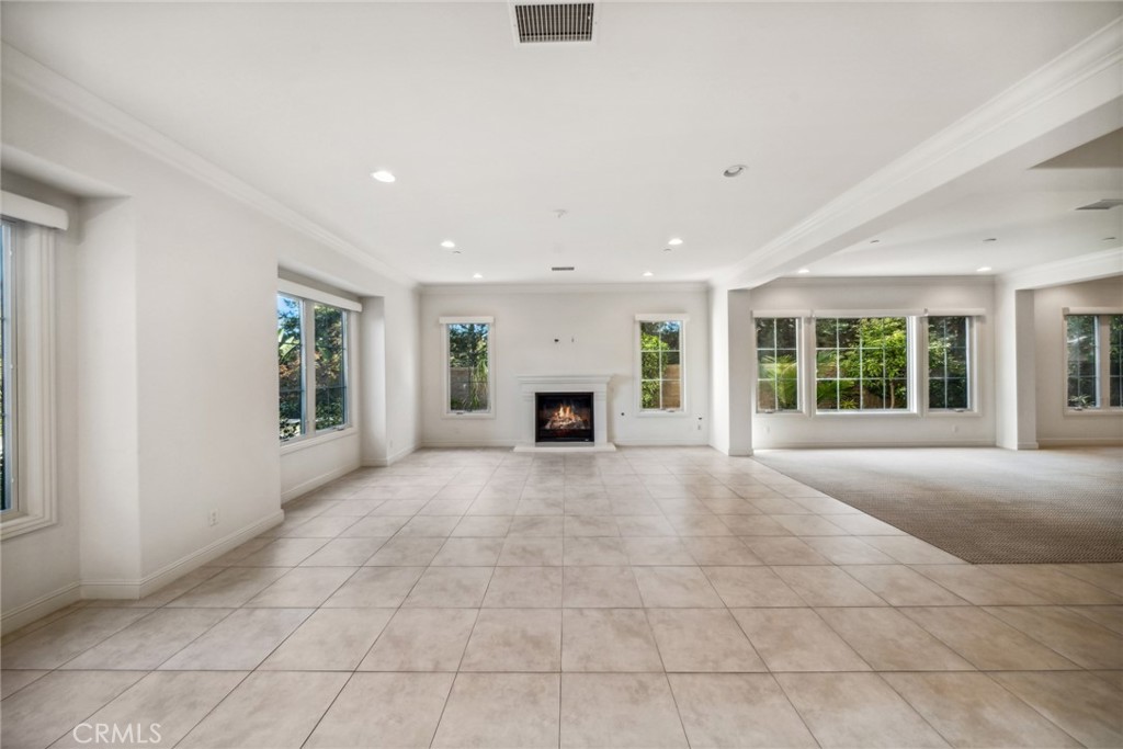 111 Whiteplume Irvine, CA 92618 - Photo 18 of 66 a view of an empty room with a fireplace and a window