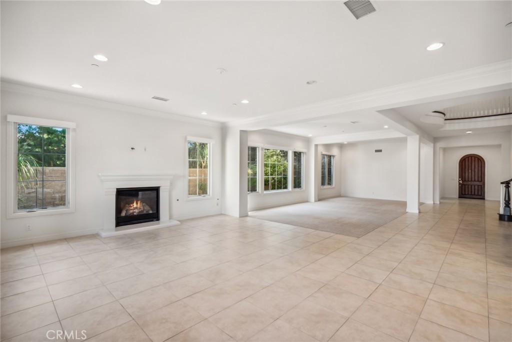 111 Whiteplume Irvine, CA 92618 - Photo 19 of 66 a view of an empty room with a fireplace and a window