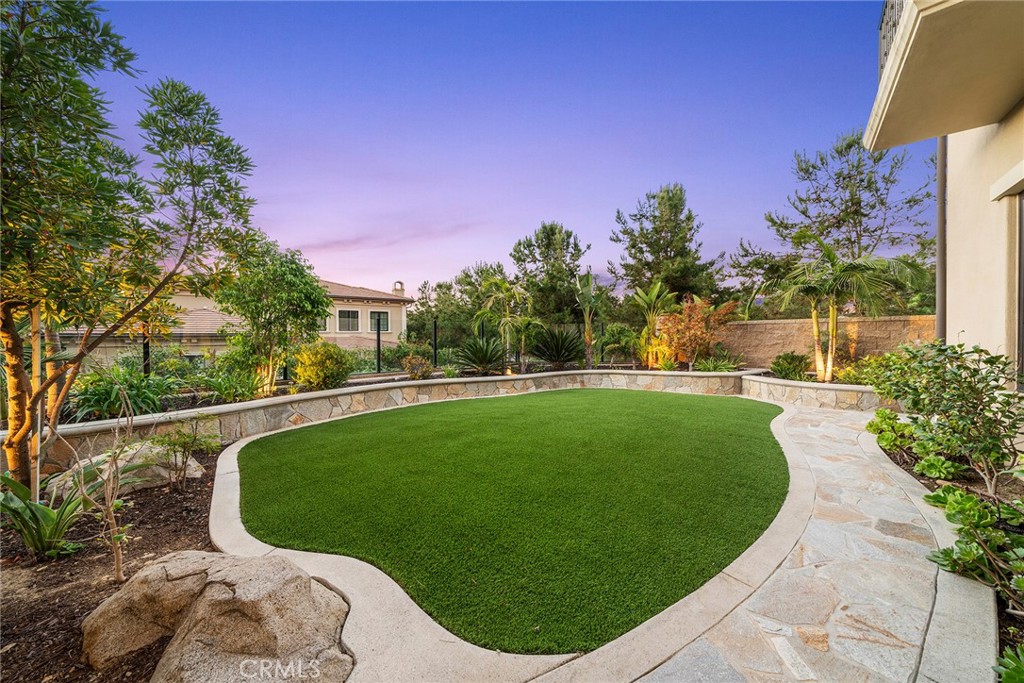 111 Whiteplume Irvine, CA 92618 - Photo 2 of 66 a view of a garden with a house in the background