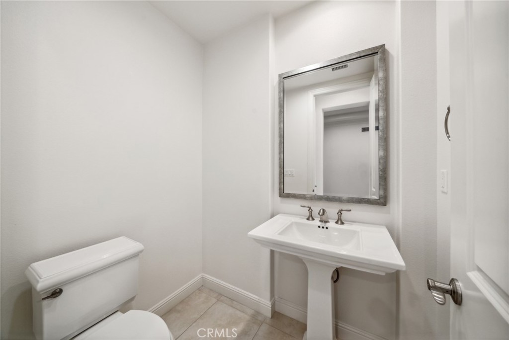111 Whiteplume Irvine, CA 92618 - Photo 26 of 66 a bathroom with a sink mirror and toilet