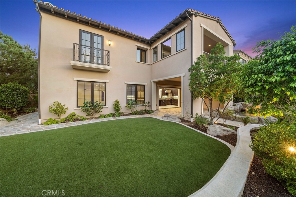 111 Whiteplume Irvine, CA 92618 - Photo 3 of 66 a front view of a house with a yard