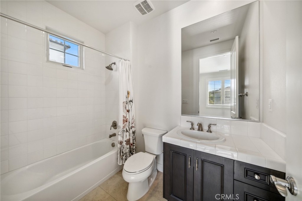 111 Whiteplume Irvine, CA 92618 - Photo 41 of 66 a bathroom with a sink a toilet and shower