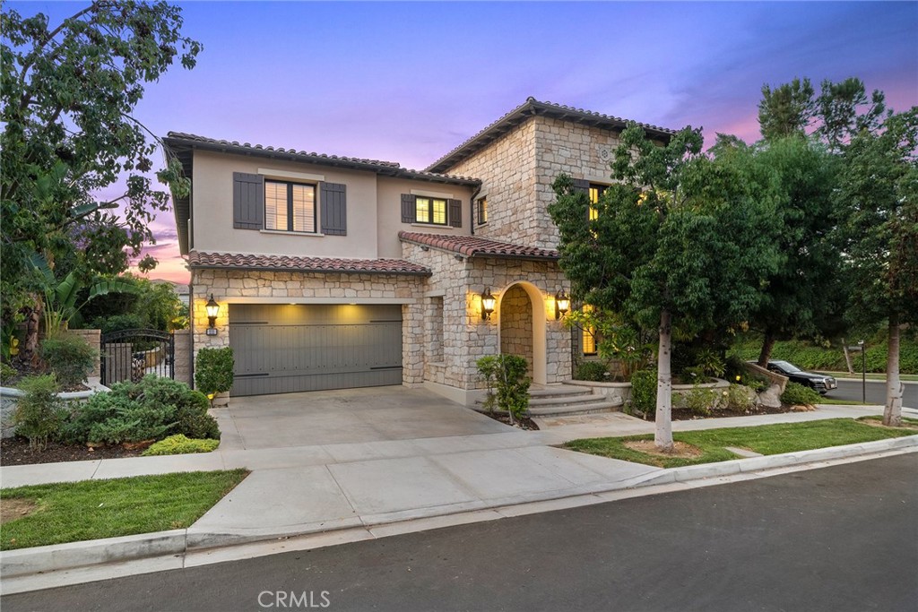 111 Whiteplume Irvine, CA 92618 - Photo 5 of 66 a front view of a house with a yard and garage