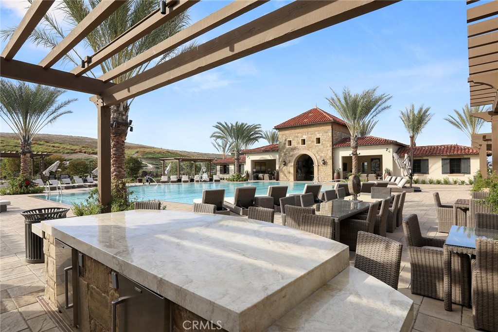 111 Whiteplume Irvine, CA 92618 - Photo 64 of 66 a very nice looking dining room with a large dining table and chairs with the view of living room