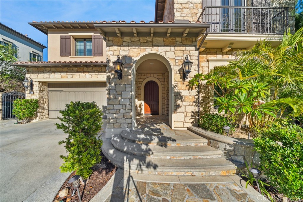 111 Whiteplume Irvine, CA 92618 - Photo 7 of 66 a front view of a house with a garden