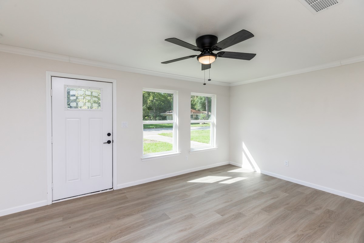 5260 Landry Lane Beaumont, TX 77708 - Photo 11 of 25 wooden floor in an empty room with a window