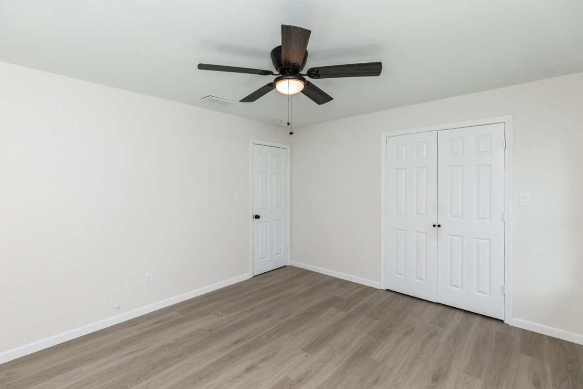 5260 Landry Lane Beaumont, TX 77708 - Photo 22 of 25 a view of empty room with wooden floor