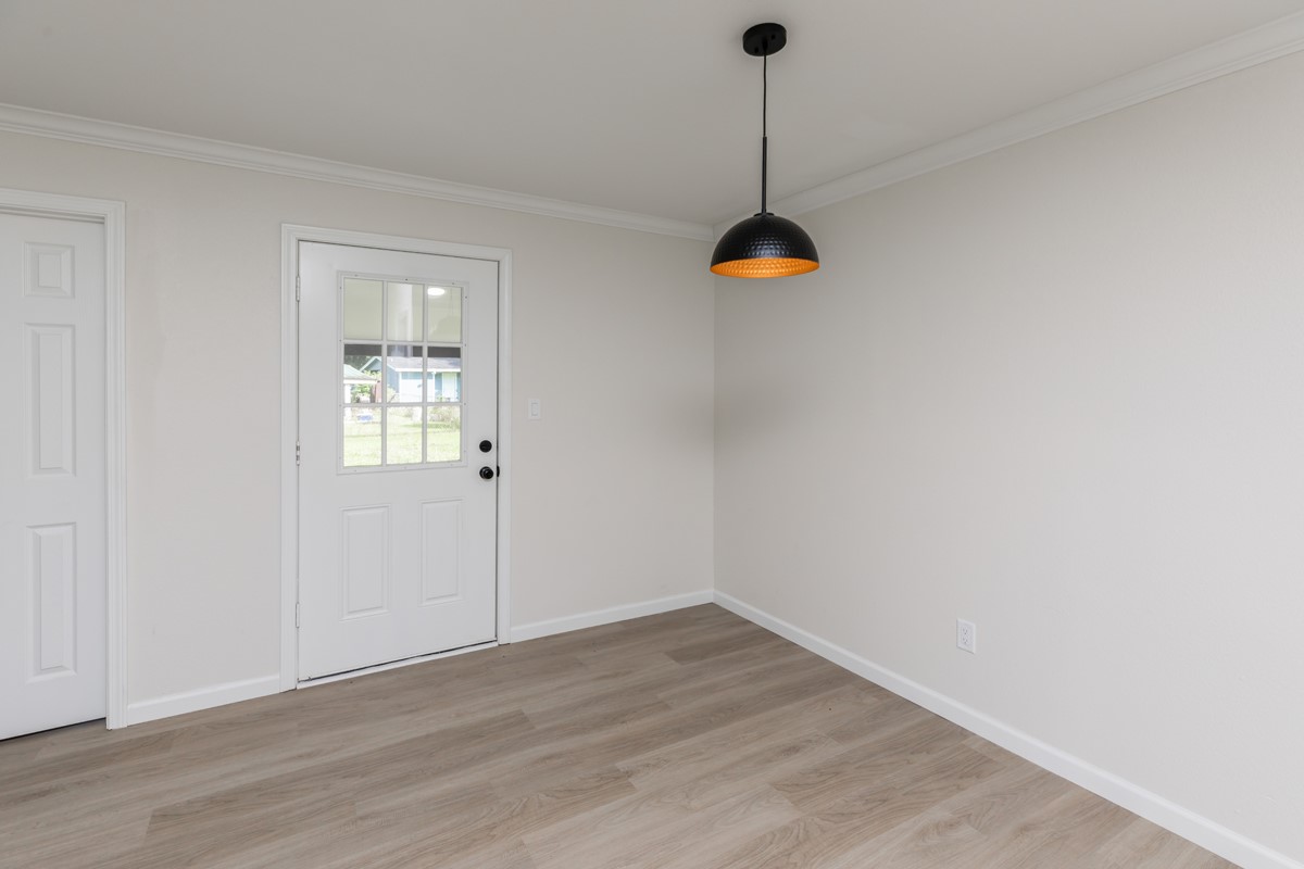 5260 Landry Lane Beaumont, TX 77708 - Photo 6 of 25 a view of empty room with wooden floor and fan