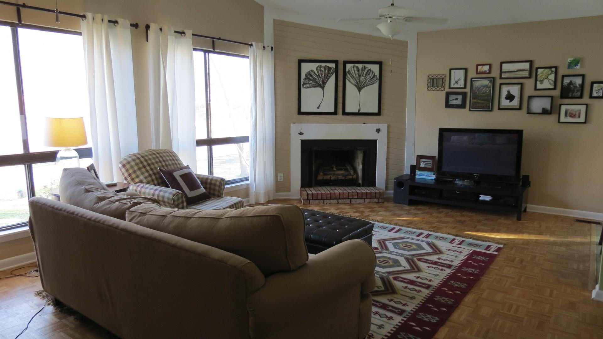 805 Castalia Drive Cary, NC 27513 - Photo 4 of 9 a living room with furniture and a fireplace