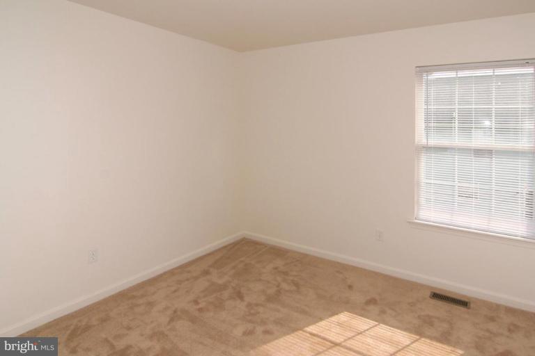 7204 Rutherford Green Circle Windsor Mill, MD 21244 - Photo 11 of 13 an empty room with a window