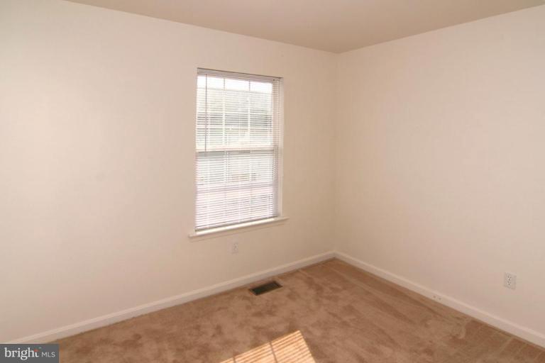 7204 Rutherford Green Circle Windsor Mill, MD 21244 - Photo 12 of 13 an empty room with a window