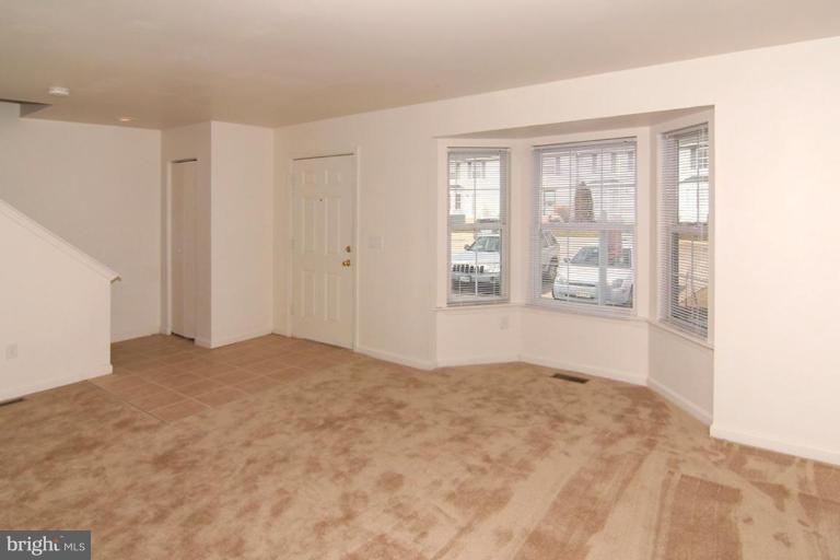 7204 Rutherford Green Circle Windsor Mill, MD 21244 - Photo 3 of 13 a view of an empty room with a window