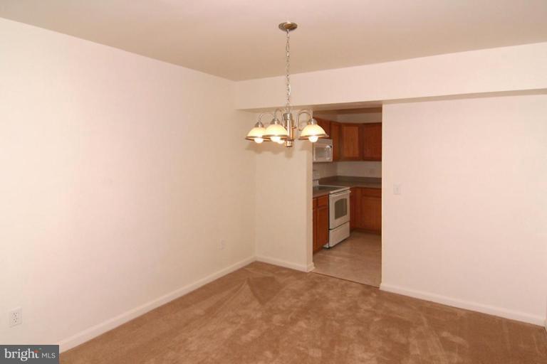 7204 Rutherford Green Circle Windsor Mill, MD 21244 - Photo 5 of 13 a view of a chandelier in a room