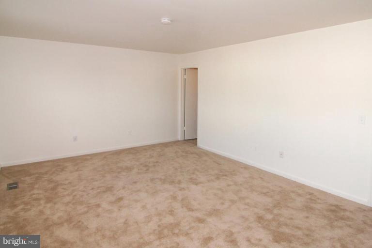 7204 Rutherford Green Circle Windsor Mill, MD 21244 - Photo 7 of 13 a view of empty room