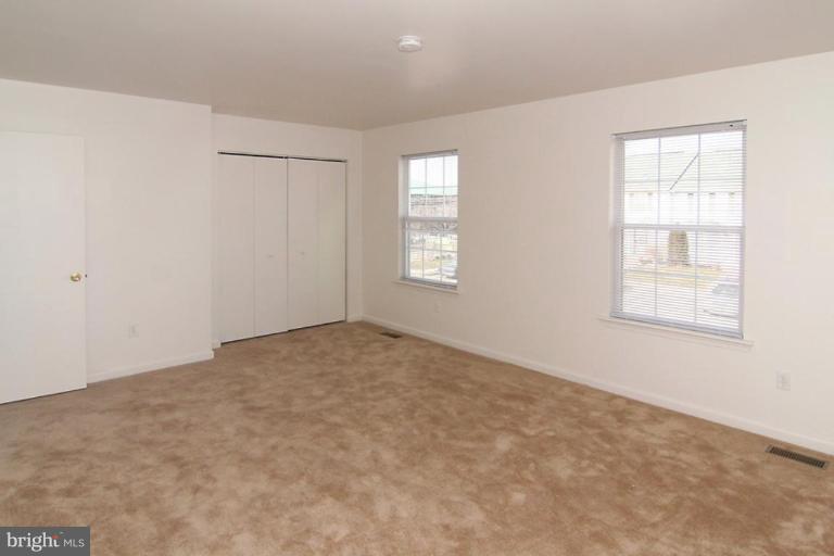 7204 Rutherford Green Circle Windsor Mill, MD 21244 - Photo 8 of 13 an empty room with windows