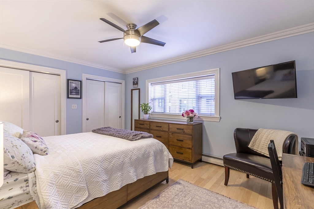 52 Cooper Street, Unit 2 Boston, MA 02113 - Photo 8 of 15 a bedroom with a bed and a flat screen tv
