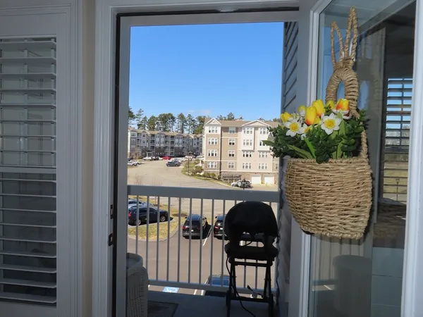 a view of a balcony with chairs