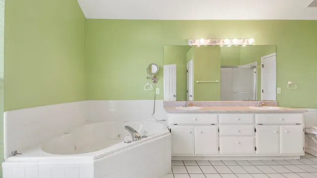 a bathroom with a bathtub and a sink