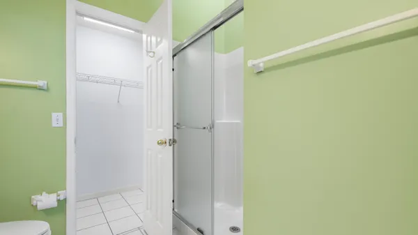 a bathroom with a shower and a toilet