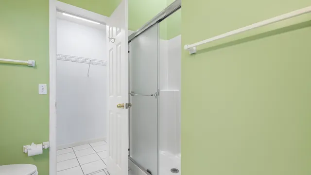 a bathroom with a shower and a toilet