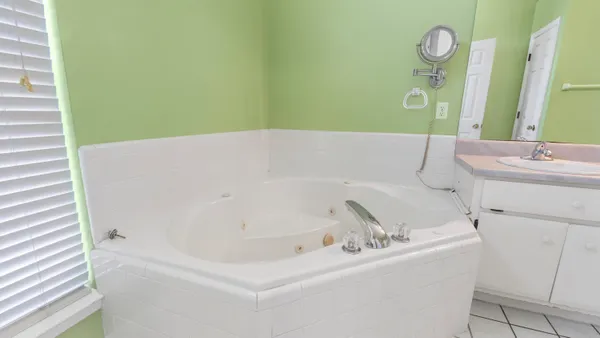 a bathroom with a bathtub and a sink