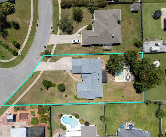 an aerial view of house with yard swimming pool and outdoor seating