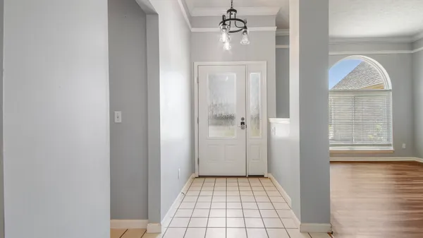 a bathroom with a glass door shower a mirror and a sink
