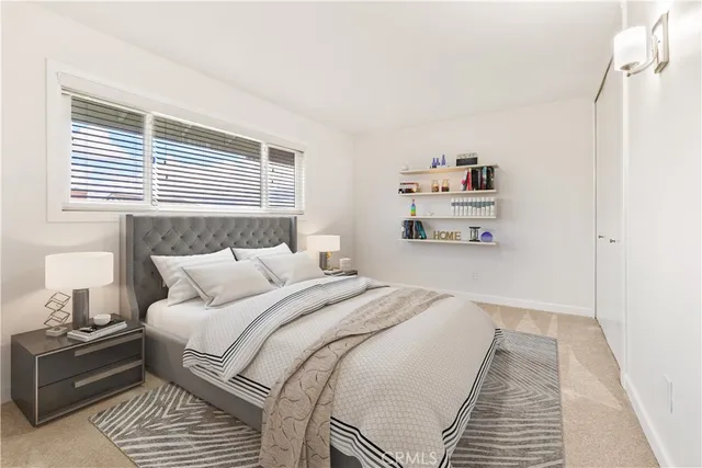 a bedroom with a bed and a cabinets