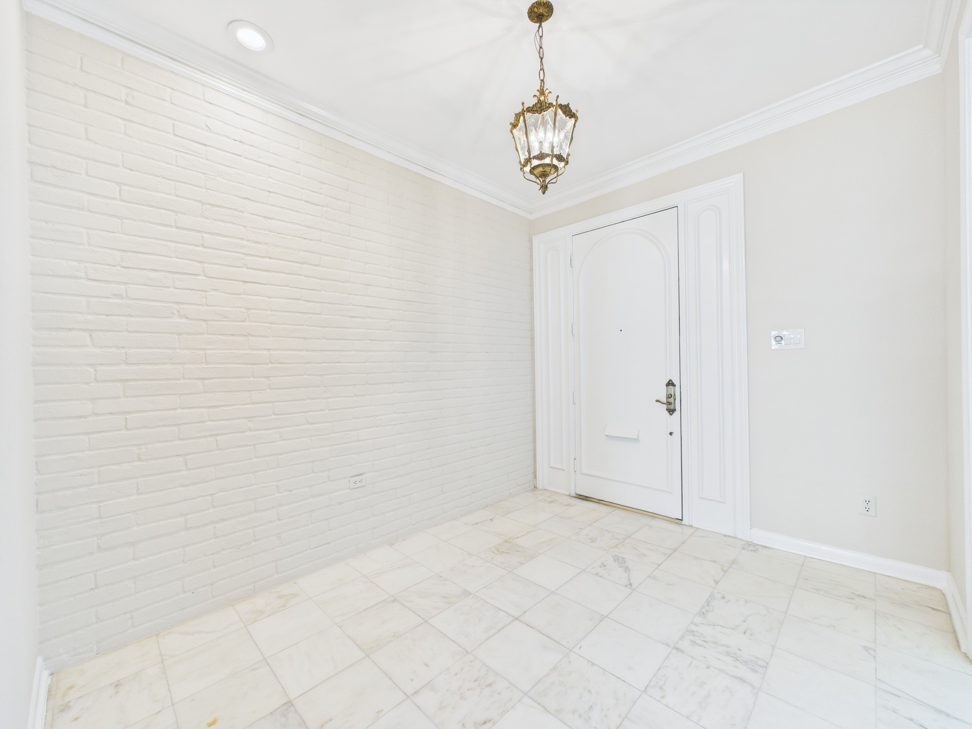7608 Del Monte Drive Houston, TX 77063 - Photo 2 of 46 Formal Entry boasting High Ceilings, Exposed Brick and Marble Flooring