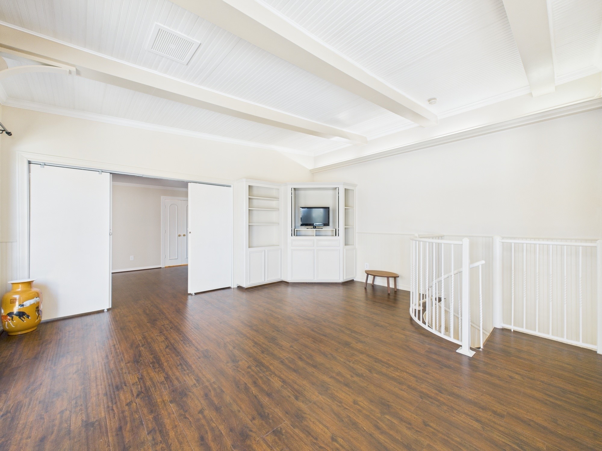 7608 Del Monte Drive Houston, TX 77063 - Photo 37 of 46 Built-in entertainment unit and spiral staircase down to the breakfast room