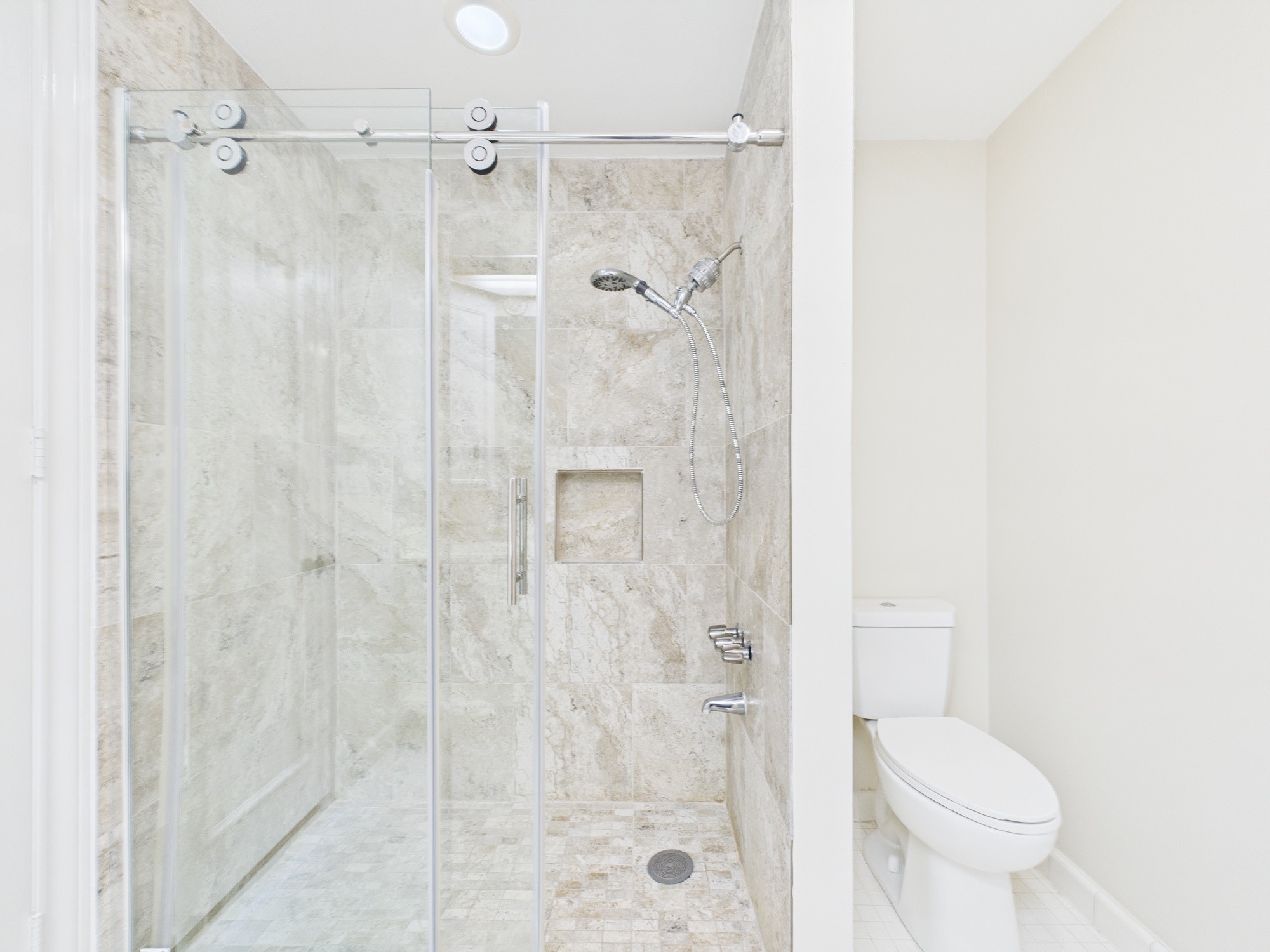 7608 Del Monte Drive Houston, TX 77063 - Photo 7 of 46 Tiled Standing Shower with Sliding Glass Door