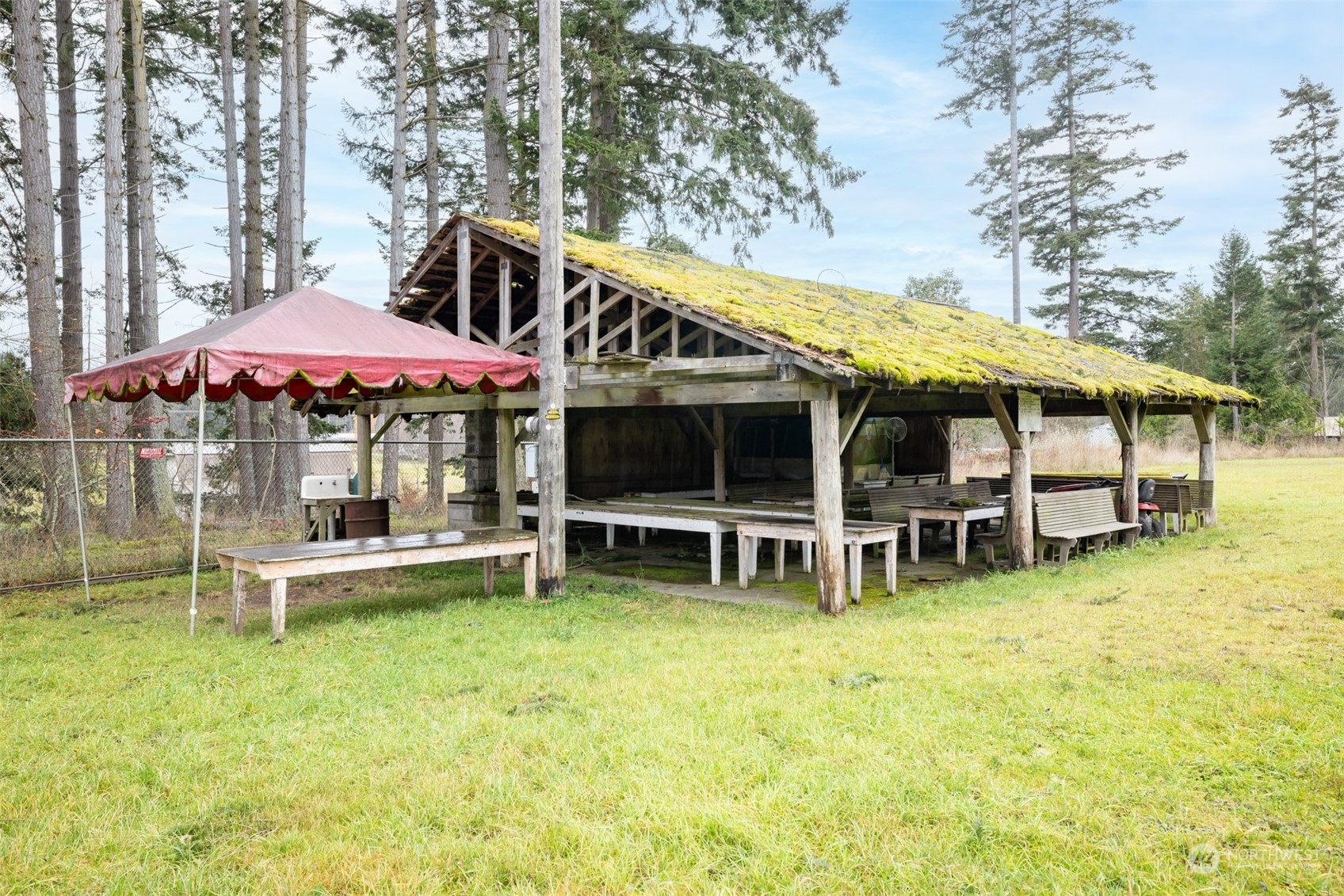 161 Lake Farm Road Port Angeles, WA 98362 - Photo 11 of 40 a view of a house with a yard patio and dining table and chairs