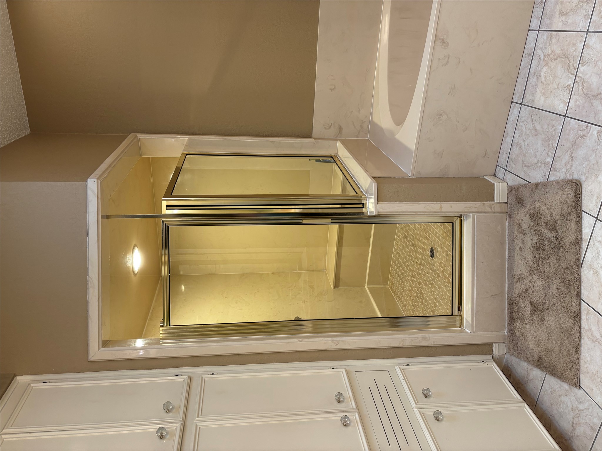 10904 Legends Lane Austin, TX 78747 - Photo 26 of 38 Primary bathroom has a separate shower and tub. Two closets with plenty of room.