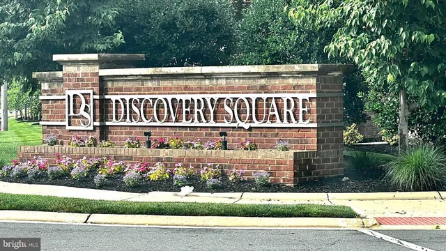 a kitchen with a sink a stove and cabinets