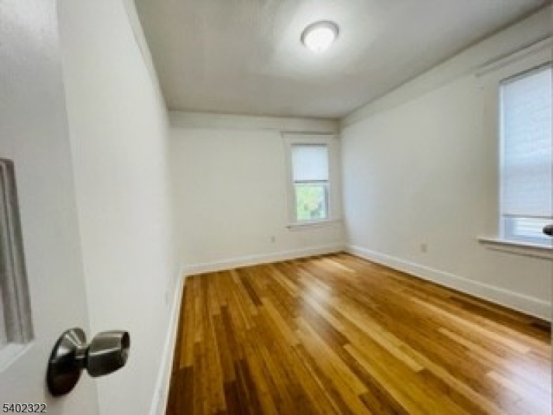 169 Hillside Avenue, Unit 2 Glen Ridge, NJ 07028 - Photo 7 of 10 a view of an empty room and window