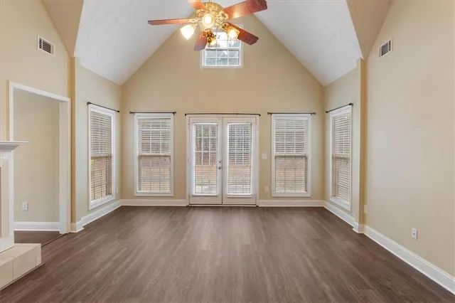 wooden floor in an empty room with a window