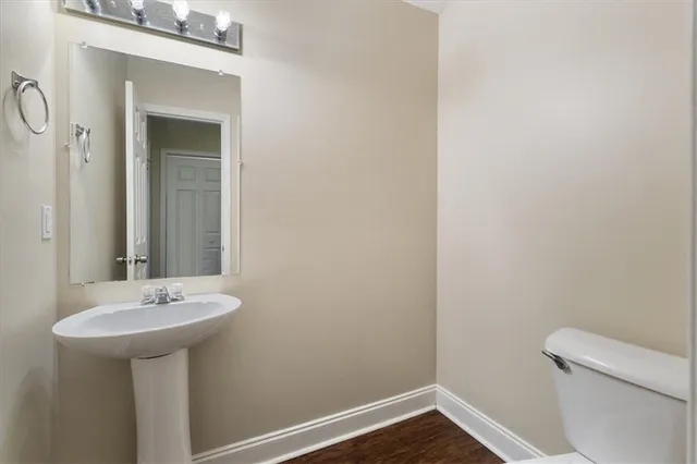 a bathroom with a sink a toilet
