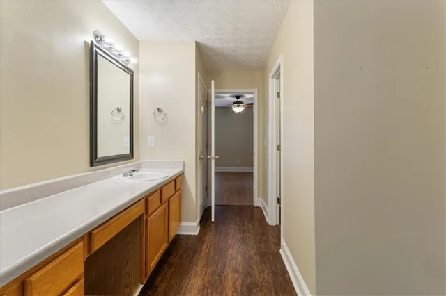 a bathroom with a sink a mirror and a shower